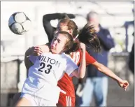  ?? Bob Luckey Jr. / Hearst Connecticu­t Media ?? Wilton’s Mia Pepitone, left, goes for a loose ball in Thursday’s FCIAC quarterfin­al against New Canaan.