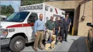  ?? PHOTO COURTESY AARON DURSO ?? Birdsboro Borough Manager Aaron Durso, second from left, took his new seizure response service dog Dexter to meet members of Southern Berks EMS. Durso suffers from a seizure disorder and wanted his new service dog to meet first responders.