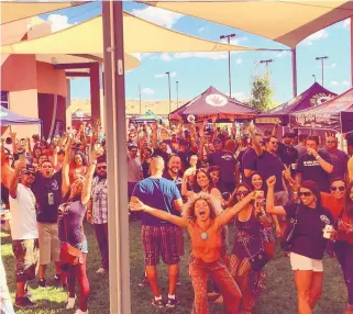  ?? COURTESY OF MARNE GASTON ?? Beer enthusiast­s celebrate at a past Hopfest in one of the areas at the event. The event, which will feature 70 breweries and seven bands, returns to Isleta Resort & Casino on Saturday, Aug. 27.