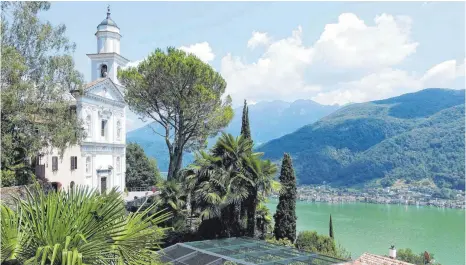  ?? FOTOS: DPA ?? Die Kirche von Morcote steht hoch über dem Luganer See.