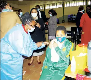  ?? (File pic) ?? Mcebo Tibusile Vermaak, receiving the COVID-19 Johnson & Johnson jab this was during the recent vaccine exercise that started at Manzini Central High School last Friday.