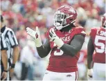  ??  ?? McTelvin Agim totaled 31 tackles for loss, 14.5 sacks and six forced fumbles in 42 games for the Arkansas Razorbacks.