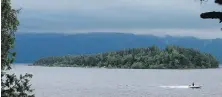  ?? MATT DUNHAM, THE ASSOCIATED PRESS ?? An emergency services boat passes the island of Utoya, Norway, after a mass shooting in July 2011.