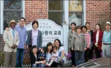  ?? NICHOLAS BUONANNO — NBUONANNO@TROYRECORD.COM ?? Members of the Albany Sarang Fellowship Church stand outside the church on 23rd Street in Watervliet.