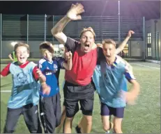  ??  ?? Active Schools’ Ewan Jamieson celebrates wildly with the pupils after scoring a worldy for the red team.