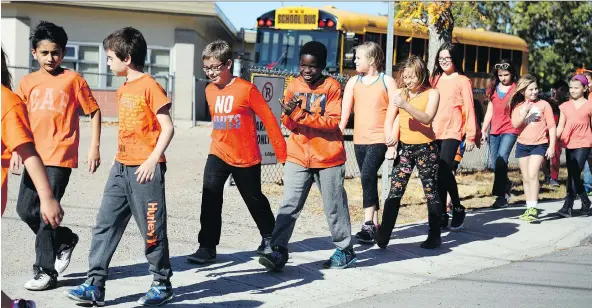  ?? PHOTOS: TROY FLEECE ?? Ecole Elsie Mironuck Community School students sport bright shirts on a walk Friday for Orange Shirt Day, one of several events held around the city to mark the day.