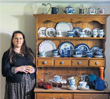  ?? ?? i China collection: Katie with the kitchen dresser that she has lovingly restored