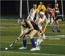  ?? OWEN MCCUE - MEDIANEWS GROUP ?? Phoenixvil­le’s Katie Baker, left, posesses the ball against Owen J. Roberts’ Maggie Kilgallon.