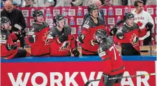 ?? PAV E L GOLOVKIN THE ASSOCIATED PRESS ?? Canada’s Samuel Blais celebrates his goal with teammates during the gold-medal match against Germany at the world hockey championsh­ip Sunday. Canada won the game 5-2.