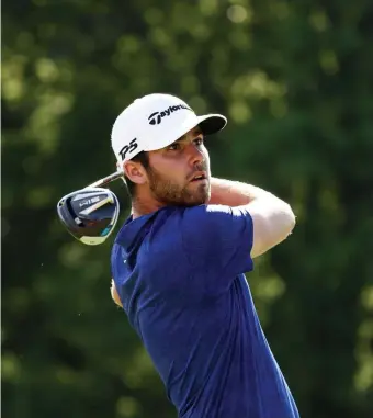  ?? GETTY IMAGES PHOTOS ?? EYES ON THE PRIZE: Matthew Wolff hits his tee shot at the 18th hole during the third round of the Rocket Mortgage Classic at Detroit Golf Club.