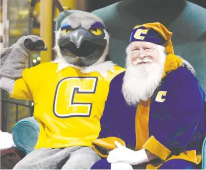  ?? STAFF FILE PHOTO ?? On Thursday night, Nov. 15, University of Tennessee at Chattanoog­a fans can take pictures with Santa in his Mocsthemed suit at Hamilton Place. UTC mascot Scrappy is pictured with Santa at his photo shoot.