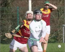  ??  ?? Jack Fortune of St. Peter’s tries to avoid a hook from Jamie Ryan.