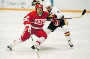  ?? — GETTY FILES ?? Vladimir Krutov (left) in action for the Soviet Union during the 1988 Winter Olympics in Calgary. Krutov, a member of the legendary Soviet KLM line, died on Wednesday aged 52.