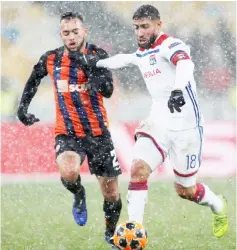  ??  ?? Lyon’s Nabil Fekir (right) in action with Shakhtar Donetsk’s Maycon. — Reuters photo