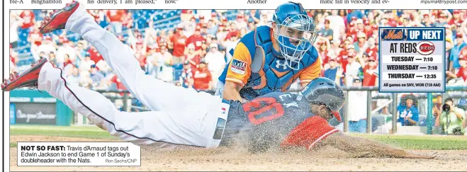  ?? Ron Sachs/CNP ?? NOT SO FAST: Travis d’Arnaud tags out Edwin Jackson to end Game 1 of Sunday’s doublehead­er with the Nats.