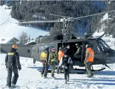  ?? THE ASSOCIATED PRESS ?? An Italian army helicopter lands during the evacuation of tourists from the Langtaufer­er hotel in the Venosta valley, northern Italy, on Tuesday after an avalanche overnight.