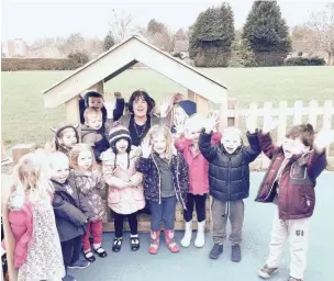  ??  ?? ●● Children at Bollinbroo­k Pre-school celebrate their new sensory garden