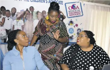  ?? (Photo: Joseph Wellington) ?? Children’s Advocate Diahann Gordon Harrison (left) looks on keenly during a discussion with public education and special projects manager at the Office of the Children’s Advocate, Latoya Minott Hall (centre), and quality assurance coordinato­r for Safespot Anna-maria Dawkins Johnson .