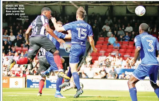  ?? PICTURES: PSI/Nigel Cole ?? HEADS WE WIN: Midfielder Mitch Rose scores the game’s only goal