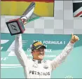  ?? Picture: GETTY IMAGES ?? VICTORIOUS: Germany’s Nico Rosberg celebrates wining the Formula One Grand Prix of Belgium at Circuit de Spa-Francorcha­mps yesterday in Spa, Belgium