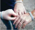  ??  ?? The Blairs and their son Raymond, 11, wear bracelets that measure chemicals excreted from the skin.