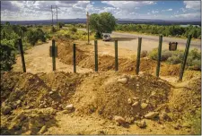  ?? NATHAN BURTON/Taos News ?? Bulldozed land can be seen obstructin­g part of the Outward Link Trail on Tuesday (Sept. 14) in Taos. Popular among families, dog walkers and
mountain bikers, the trail connects the Youth and Family Center with the South Boundary and Ojitos trails.