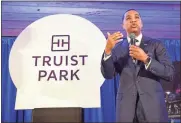  ?? Marietta Daily Journal - Thomas Hartwell ?? Donta Wilson, the chief digital and client experience officer for Truist, speaks about the renaming of Suntrust Park to Truist Park on Tuesday.