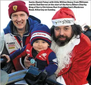  ??  ?? Santa (Daniel Foley) with little Willian Deasy from Milltown and his Dad Darren at the start of the Kerry Bikers Charity Ring of Kerry Christmas Run from Sheahan’s Muckross Road, Killarney on Sunday.