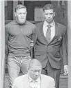  ?? Theodore Parisienne / N.Y. Daily News ?? MMA fighter Conor McGregor leaves a police station in New York after posting $50,000 bond Friday. McGregor was involved in a melee in advance of UFC 223.