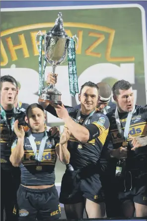  ?? PICTURE: STEVE RIDING ?? ON TOP OF THE WORLD: Captain Kevin Sinfield holds the World Club Challenge trophy after Leeds Rhinos’ victory against Manly Sea Eagles in 2012.