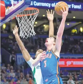  ?? SUE OGROCKI AP ?? Oklahoma City guard Josh Giddey (3) became the youngest NBA player to have a triple-double at 19 years, 2 months, 23 days on Sunday against Dallas.