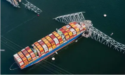  ?? ?? The Dali container vessel after striking the Francis Scott Key Bridge that collapsed into the Patapsco River in Baltimore, Maryland, US, on Tuesday. Photograph: Al Drago/Bloomberg via Getty Images