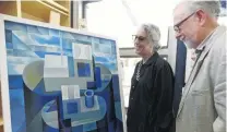  ?? PHOTO: MARK PRICE ?? Avantgarde . . . RDS Gallery director Hilary Radner and Alistair Fox, both of Dunedin, admire the winning painting at the Craigs Aspiring Art Prize exhibition in Wanaka.