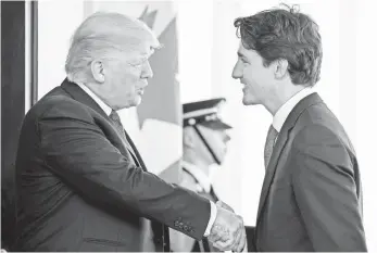  ??  ?? President Trump welcomes Canadian Prime Minister Justin Trudeau to the White House.