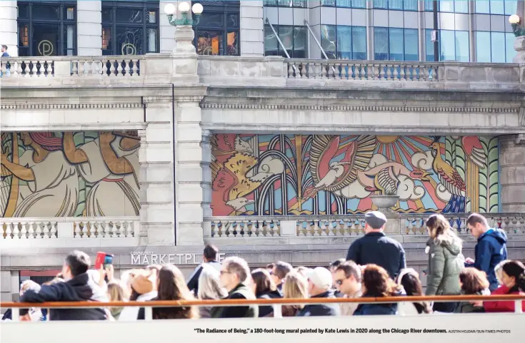  ?? AUSTIN HOJDAR/SUN-TIMES PHOTOS ?? “The Radiance of Being,” a 180-foot-long mural painted by Kate Lewis in 2020 along the Chicago River downtown.