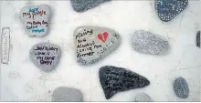  ?? MATHEW MCCARTHY WATERLOO REGION RECORD ?? Stones with messages were on display to mark Internatio­nal Overdose Awareness Day at Dickson Park in Cambridge on Monday.