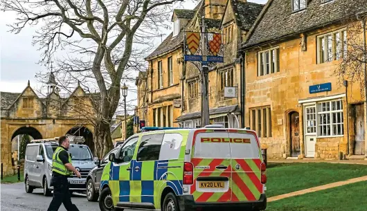  ?? ?? Probe: Police outside the flat in Chipping Campden where Beatrice Corry was found suffering head injuries before she died