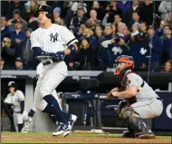  ?? ANDREW SAVULICH/ TRIBUNE NEWS SERVICE ?? The Yankees' Aaron Judge hits a threerun home run against the Houston Astros on Monday at Yankee Stadium in New York.