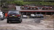  ?? FILE PHOTO BY WILLIAM J. KEMBLE ?? State Department of Environmen­tal Conservati­on police SUVs are parked at Joseph and Rachel Karolys’ debrisproc­essing site on Route 212 in Saugerties, N.Y., on May 17.