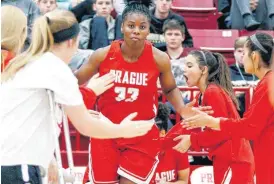  ?? [PHOTO BY NATE BILLINGS, THE OKLAHOMAN] ?? Prague’s Chantae Embry is introduced before a game against Comanche in December. Embry, a freshman, is committed to Oklahoma State and regarded as one of the top recruits in the nation.