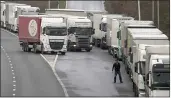  ?? GARETH FULLER — PA ?? A lorry driver views the line of vehicles as they wait to enter the Eurotunnel in Folkestone, Kent, England, on Friday. Traffic was heavy as the clock ticks down before the end of the Brexit transition period on Dec. 31.