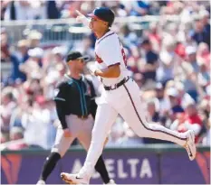  ?? AP PHOTO/JOHN BAZEMORE ?? Matt Olson watches his second-inning home run leave the park as the Atlanta Braves defeated Arizona 5-2 Sunday at Truist Park in Atlanta.