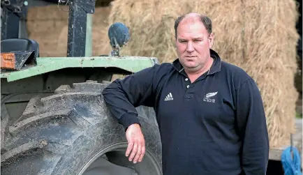  ?? PHOTO: MURRAY WILSON/STUFF ?? Andrew Hoggard enjoyed a thundersto­rm bringing much-needed rain to his farm.