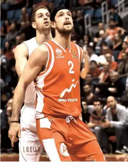  ?? (Dov Halickman Photgraphy) ?? BEN EISENHARDT (2) misses banging down low on the basketball court, but the Hapoel Beersheba center is optimistic the local season will resume at some point after the coronoviru­s is under control.