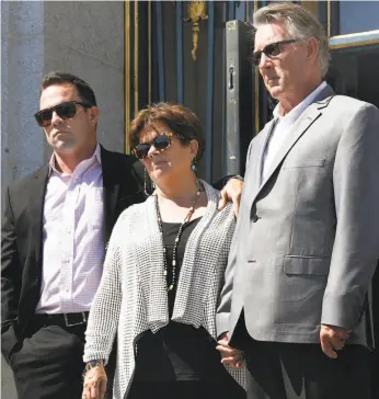  ?? Liz Hafalia / The Chronicle ?? Brad Steinle, Liz Sullivan and Jim Steinle met the media at City Hall on Sept. 1.