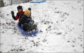  ?? JOSEPH PHELAN — JPHELAN@DIGITALFIR­STMEDIA.COM ?? All smiles as Francisco Cupp and Carter Phillips enjoy sledding on the first snow day of the school year.