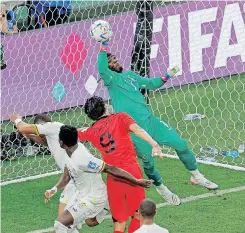  ?? | AFP ?? GHANA goalkeeper Lawrence Ati Zigi denies South Korea during their pulsating Group H clash yesterday.