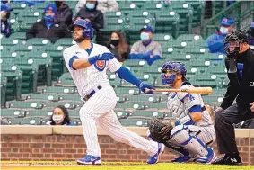  ?? DAVID BANKS/ASSOCIATED PRESS ?? David Bote of the Cubs hits a three-run double in the first inning of Chicago’s 7-1 win over Clayton Kershaw and the Dodgers in the opener of a twin bill at Wrigley Field.