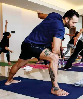  ?? ANWAR AMRO/GETTY IMAGES ?? Mindfulnes­s is commonly associated with practices like yoga and tai chi, but it is a useful part of all forms of training and exercise.