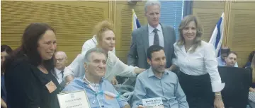  ?? (Courtesy) ?? THE KNESSET CAUCUS for Lone Soldiers yesterday awards Lt.-Col. Tzvika Levy (res.) with a plaque acknowledg­ing his 25 years of volunteeri­ng as the “father of lone soldiers.”